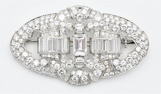 Platinum Diamond Brooch, oval shape measuring approximately 2 x 1 ¼ inches; pave set with 158 round full and single cut diamonds, approximate total ca