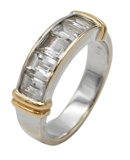 18 Karat White and Yellow Gold Ring, set with five emerald cut diamonds, largest in center 3.7 x 4.3 millimeters, size seven, 7 grams.