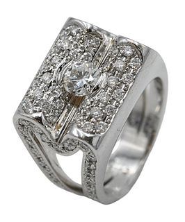 18 Karat White Gold Ring, set with center round diamond, approximately 4.98 millimeter diameter and diamonds under and over center, along with diamond