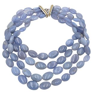 Tambetti Four Strand Necklace, having blue chalcedony with subtle lavender oval stones, along with a white and yellow gold clasp marked 14 karat and 1