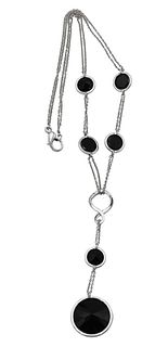 14 Karat White Gold Necklace, having small diamonds and black circles, total weight 18.2 grams.