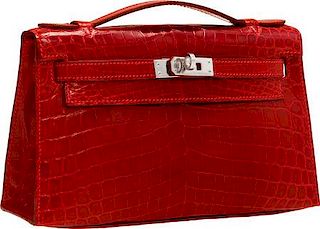 Hermes Shiny Rouge H Nilo Crocodile Kelly Pochette Bag with Palladium Hardware Excellent Condition 8.5" Width x 5" Height x 2.5" Depth