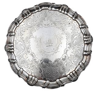 Robert Rew, 1754, silver salver having scrolled and fan carved edge along with overall chased design, height 1 1/4 inches, diameter 10 inches, 18.7 t.
