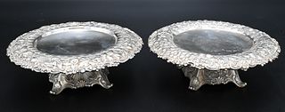 Tiffany & Company Pair of Sterling Silver Compotes, having repousse rims along with scroll feet, diameter 6 1/2 inches, 22 t.oz. Provenance: Estate of