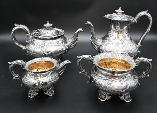 English Silver Four Piece Tea and Coffee Set, in the Japanese taste, to include coffee pot, teapot, sugar and creamer, all having pagodas and landscap