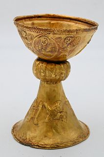 Italian Gold Chalice 
circa 1880 
having heavy chasing overall along with embossed angels and animals, tests between 14 and 18 karat gold 
height 6 1/