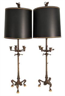 Pair of Napoleon Patinated Bronze Candelabras, having oil form central front with five candlestick arms, on tall standard on paw-footed tripartite bas