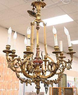 Gilt Bronze Louis XV Style Chandelier, having marble center with nine lights, height 40 inches, diameter 25 inches. Provenance: The Estate of Alina Ro