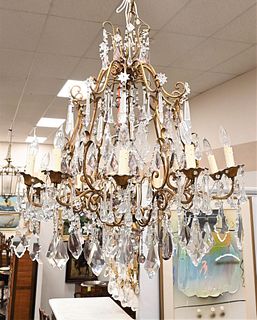 Brass and Crystal Chandelier, having some light amethyst crystals along with 13 lights, height approximately 48 inches, diameter approximately 32 inch