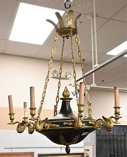 French Empire Style Gilt Bronze Chandelier, having torch form finial over black metal body with bronze mounts and eight swan-form arms with candle hol