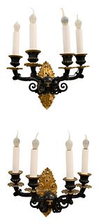 Pair of French Empire Bronze Wall Sconces, having four arm lights each, patinated bronze body with gold bronze fittings, scroll gilt backplate, electr