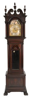 Waltham Mahogany Tall Case Clock, having three finial top with broken arch, Elliot works with moon phases, along with triple brass weights set on paw 