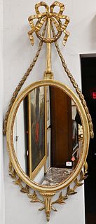 George III Mirror, having gilt carved surround and ribbon pediment, height 60 inches, width 25 1/2 inches.