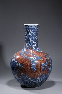 Yongzheng Period, Qing Dynasty: An Iron Red Blue and White Glazed Red Sky Ball Vase