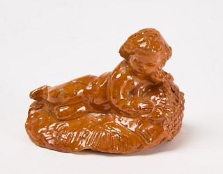 Redware Figure of a Reclining Child