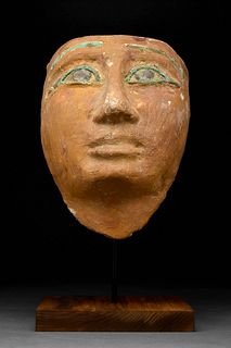 AN EGYPTIAN GESSO-PAINTED WOOD MUMMY MASK