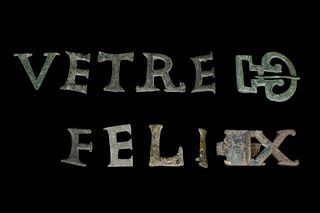 A ROMAN SET OF SILVER MILITARY BELT LETTERS FOR SAYING FELIX VETRE