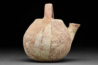 A CANAANITE PAINTED POTTERY SPOUTED JAR