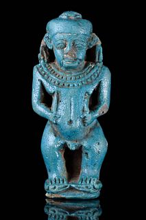 AN EGYPTIAN FAIENCE TURQUOISE GLAZED COMPOSITION PATAIKOS AMULET