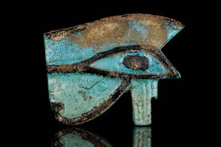 A LARGE FAIENCE WEDJAT-EYE COMPOSITE AMULET
