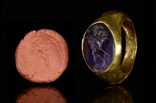 A ROMAN GOLD RING WITH AMETHYST INTAGLIO DEPICTING CUPID