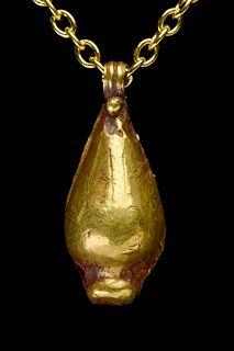 AN ANCIENT EGYPTIAN GOLD LOTUS BEAD