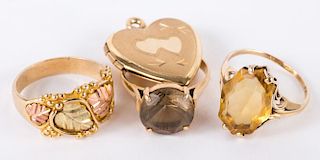 Three Rings and a Gold Heart Locket