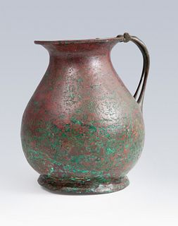 Etruscan jug. V-IV century BC. 
In bronze. 
Measures: 16,5 x 15 x 14 cm.