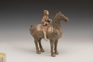 Horse with rider; Han Dynasty, 206 B.C- 220 A.D. 
Polychrome terracotta. 
The horse presents breakage in one of its ears. 
Measures: 29 x 30 x 13 cm.