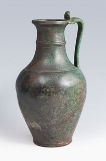 Roman jug of the I-II century AD. 
Bronze. 
Measures: 23,5 x 14 x 13 cm.