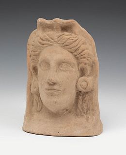 Etruscan votive head; 6th-5th century BC. 
Terracotta.