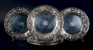 Eight Kirk "Repousse" bread & butter plates