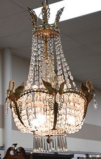 French Empire Gilt Bronze and Crystal Chandelier, having six full bodied swans along with six lights, height 40 inches, diameter 21 inches.