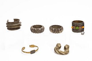 SIX PIECES OF AFRICAN BRASS CURRENCY BRACELETS