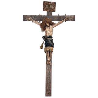 CRUCIFIED CHRIST MEXICO, 19H CENTURY Polychrome wood carving. Includes natural hair and original clothing 67.7 x 38.5 x 9" (172 x 98 x 23 cm) | CRISTO