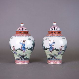PAIR OF FAMILLE ROSE 'BOYS' JARS AND COVERS, JIAQING MARK 