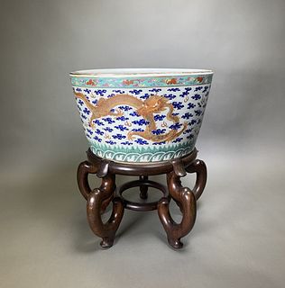 A CHINESE 'DRAGON' JARDINIERE WITH STAND, 19TH CENTURY  