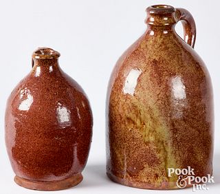 <strong>Two New England redware jugs, 19th c.