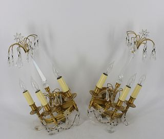 A Pair Of Gilt Bronze And Crystal Sconces .