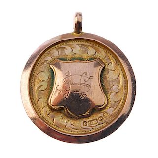 A 1930's 9ct gold and enamel fob medal, the circular form with monogrammed shield cartouche and enam