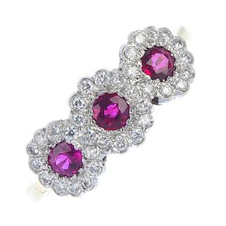 A ruby and diamond triple cluster ring. The three circular-shape rubies, each within a brilliant-cut