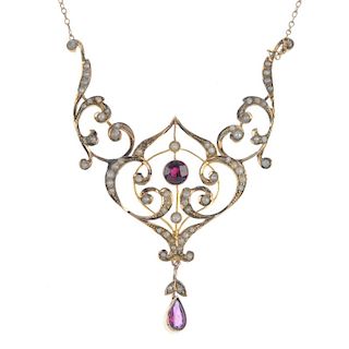An early 20th century 9ct gold, garnet and split pearl necklace. Of openwork design, the circular-sh