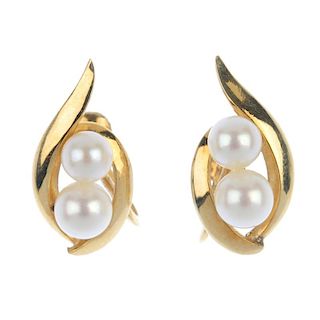 MIKIMOTO - a pair of cultured pearl ear clips. Each designed as two graduated pearls, measuring 6.2