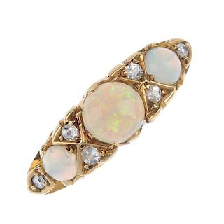 An Edwardian opal and diamond ring. The graduated circular opal cabochon line, with old-cut diamond