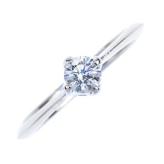 An 18ct gold diamond single-stone ring. The brilliant-cut diamond to the tapered knife-edge band. Es