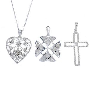 A selection of three 9ct gold diamond pendants. To include a diamond cross pendant, a diamond geomet