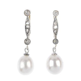 A pair of cultured pearl and diamond ear pendants. Each designed as a cultured pearl, suspended from