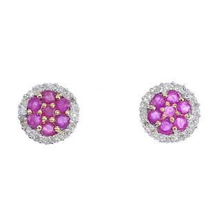 A pair of 9ct gold ruby cluster ear studs. Each of circular-outline, the circular-shape ruby cluster