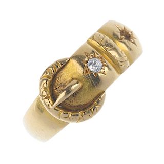 A late Victorian 18ct gold buckle ring. The textured buckle with old-cut diamond accents. One diamon