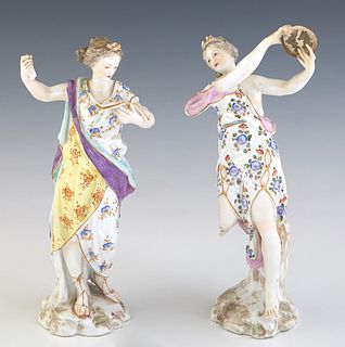 Two Continental Porcelain Figures, 19th c., of women, one of a dancer with a tambourine, the other holding a book, with impressed numbers on the under